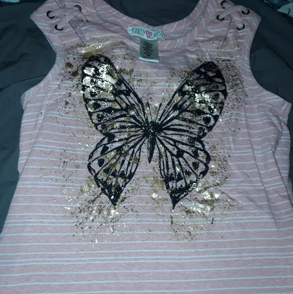 Young girl sleeveless pink and white shirt
